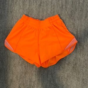 Lululemon size 4 tall orange shorts! Barley ever worn and in perfect condition!